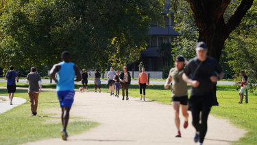 People exercise at Albert Park Lake in Melbourne on Saturday.