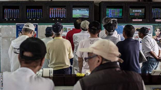 Punters gambling on keirin racing in Japan watch broadcasts of races around the country