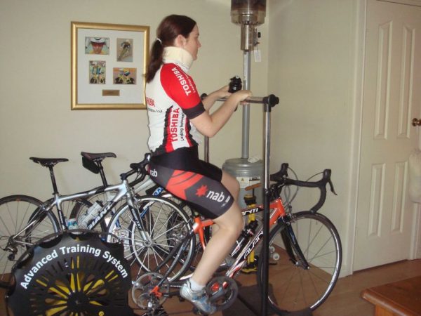 Anna Meares sits facing the right side of the photo with a neck brace on.