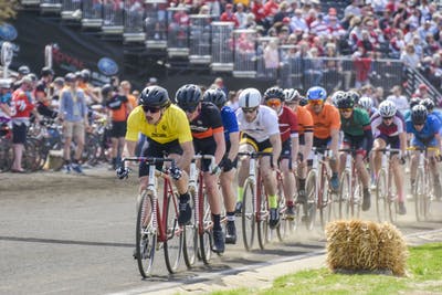 Riders race down the track April 13, 2019, during the Men&#x27;s Little 500 race at Bill Armstrong Stadium. All riders were granted an extra year of eligibility due to the ongoing COVID-19 pandemic, according to an email from race director Andrea Balzano.