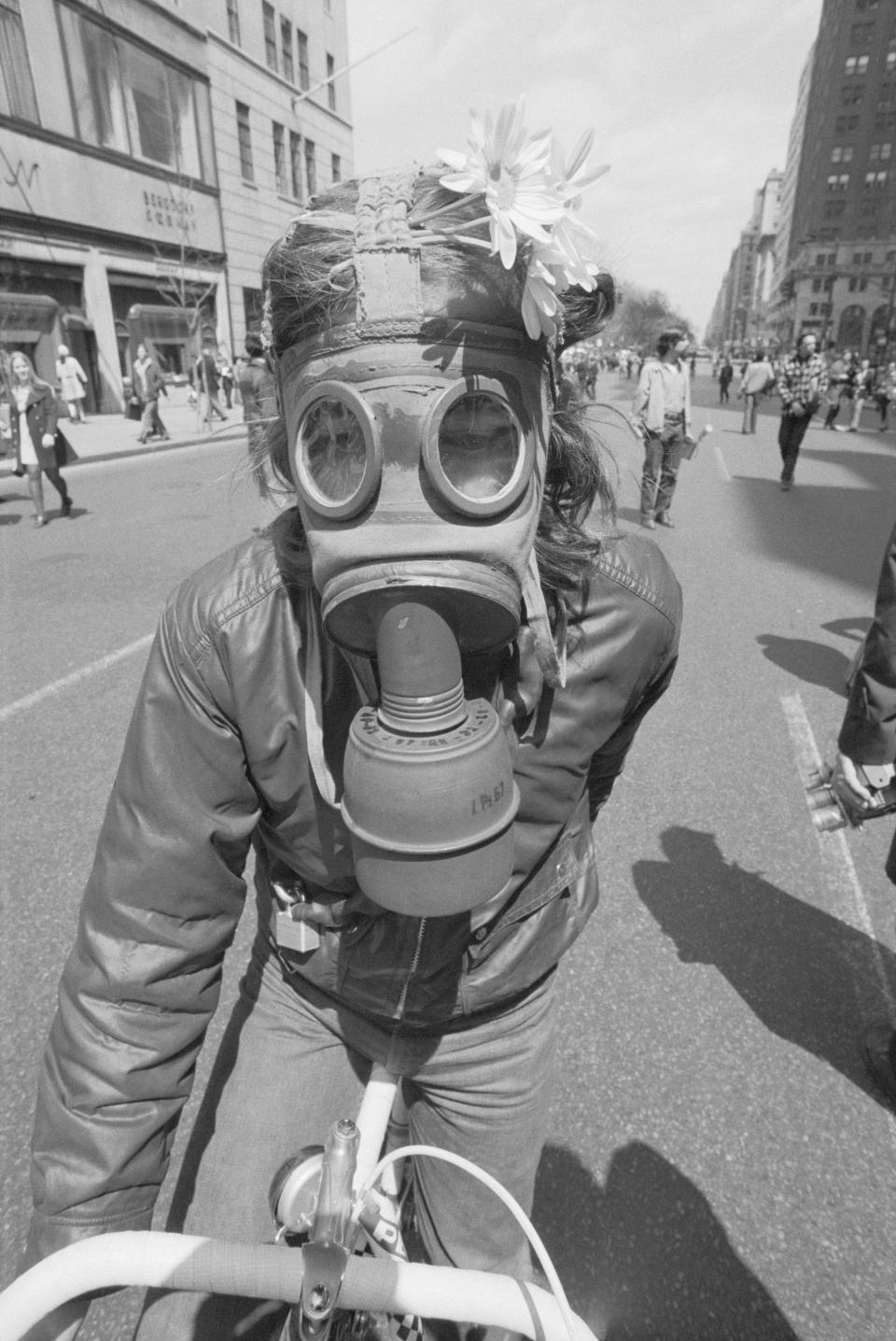 Woman In Gas Mask W/Flowers In Her Hair