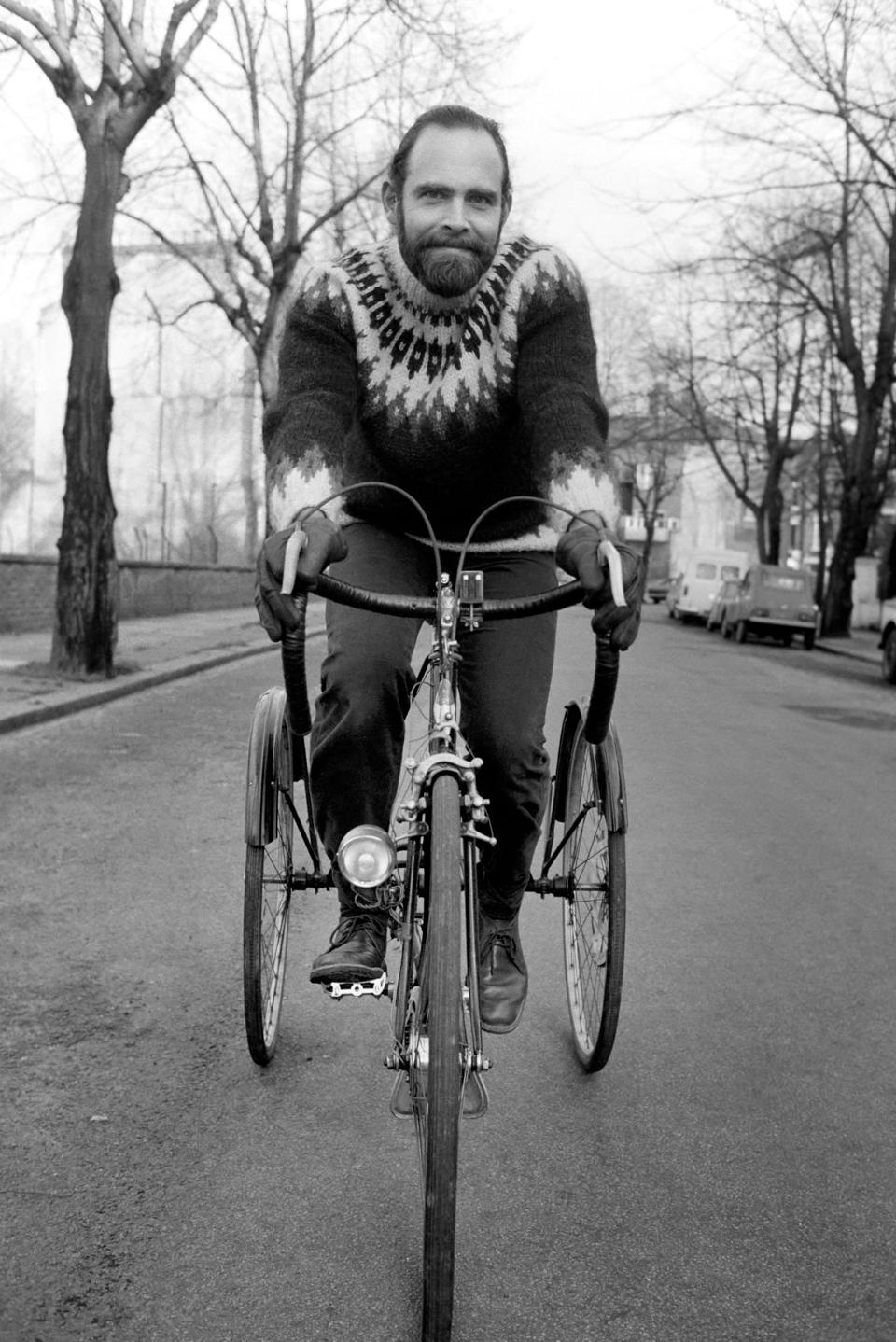 Cycling journalist and writer Mr. Richard Ballantine riding a bicycle February 1975