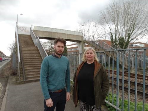 Councillors Danny Myers and Margaret Wells next to the bridge over the railway in Clifton