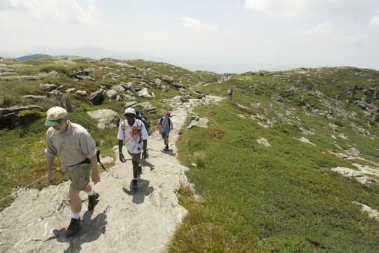 Day hikers head for the Chin, the highest point along the Vermont Long Trail at the summit of Mt. Mansfield at 4,395 feet.
