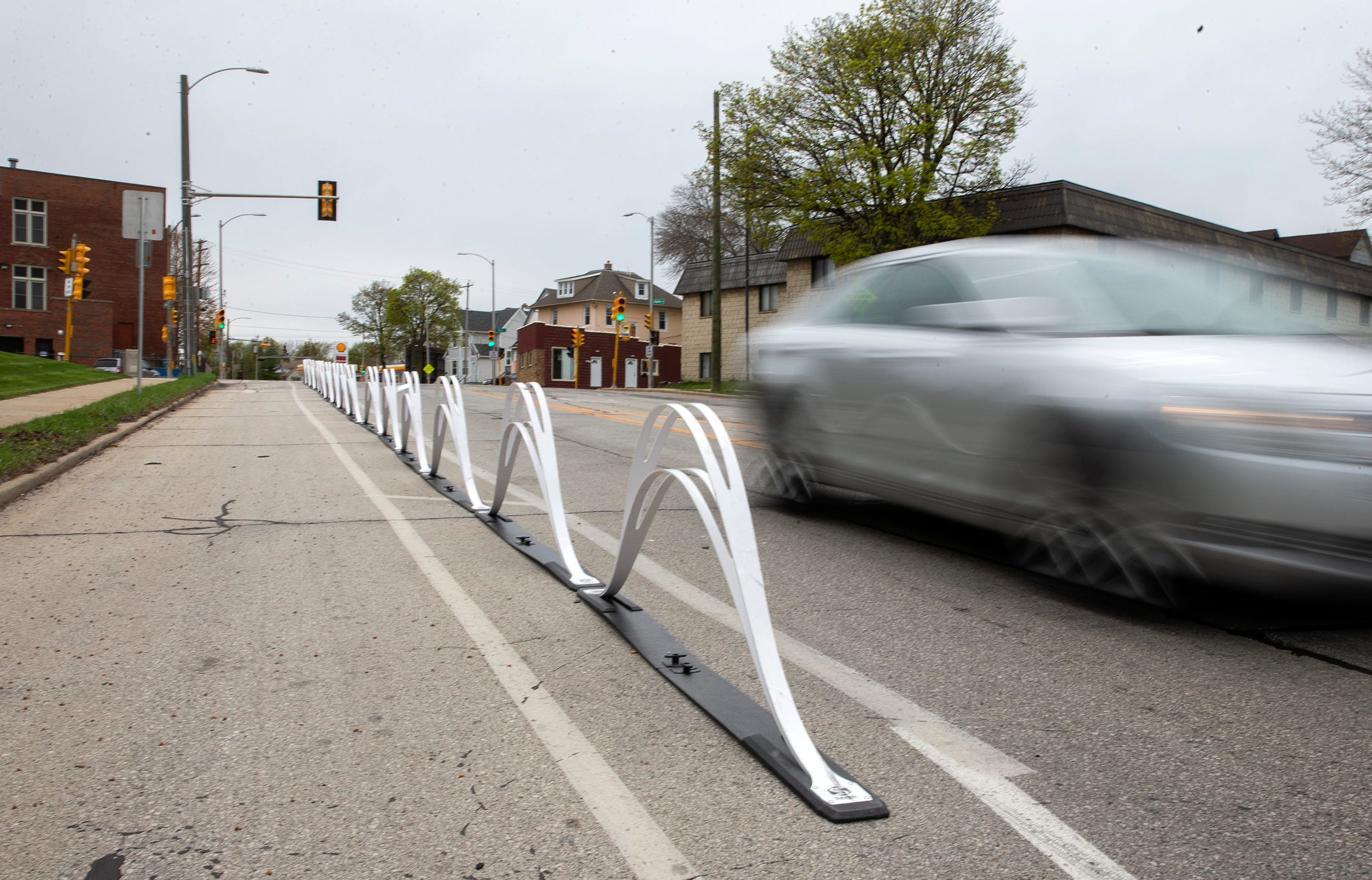 Wave delineators are placed to divide bike lane and driving lane and automobile lanes on Tuesday, May 5, 2020 on North Hawley Road.