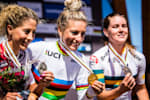 Jolanda Neff, Pauline Ferrand Prévot and Rebecca McConnell celebrate on the podium at UCI MTB XCO Elite Women during the World Championships in Mont Saint Anne, Canada on August 31, 2019