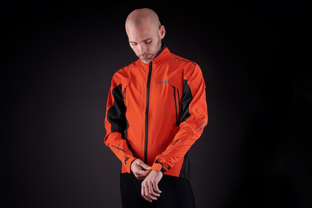Waterproof jacket in orange from Madison for road cycling