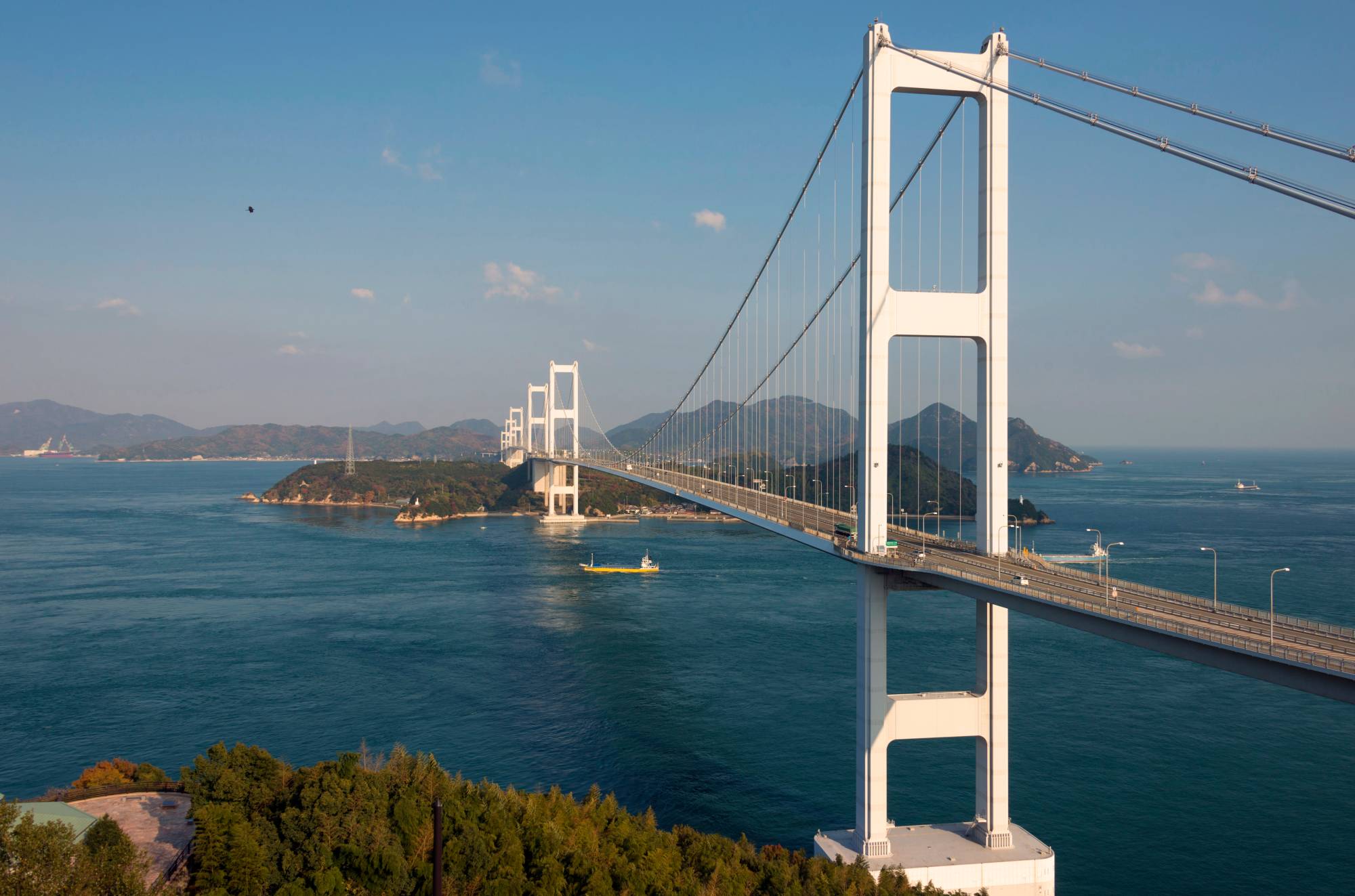 The Kurushima Kaikyo Ohashi — at 6.4 kilometers in length, the world’s longest suspension bridge structure and entranceway to the Setouchi Shimanami Kaido cycling route — near the city of Imabari, Ehime Prefecture, in November 2017 | ROB GILHOOLY