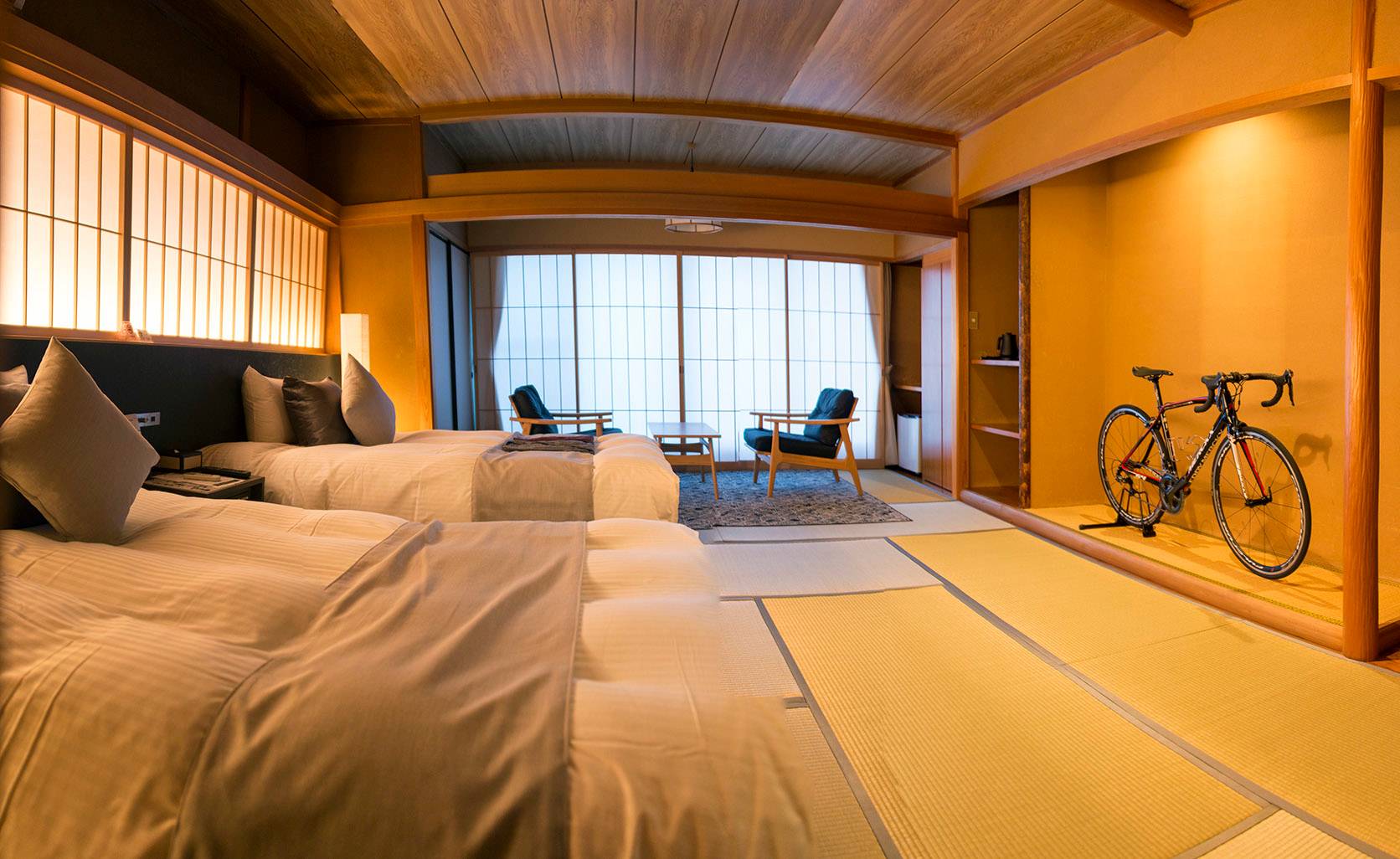 The rooms at Kona Stay hotel in the city of Izunokuni, Shizuoka Prefecture, have a storage space for bicycles. | ROB GILHOOLY