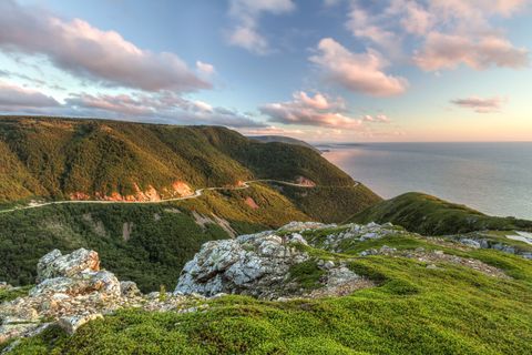 the winding cabot trail road seen from high above on the skyline trail at sunset in cape breton highlands national park, nova scotia