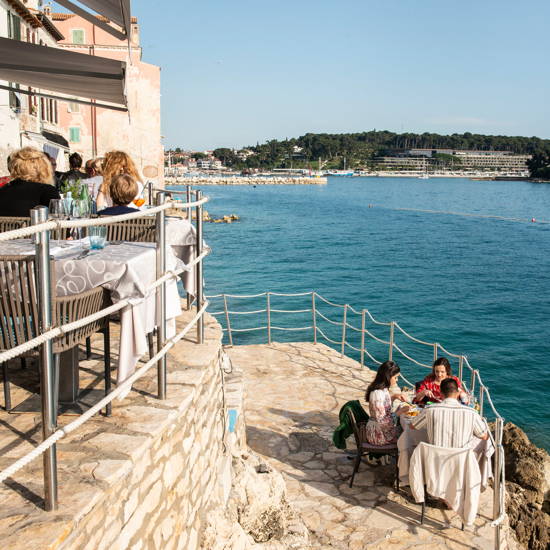 Diners in a restaurant by the sea.