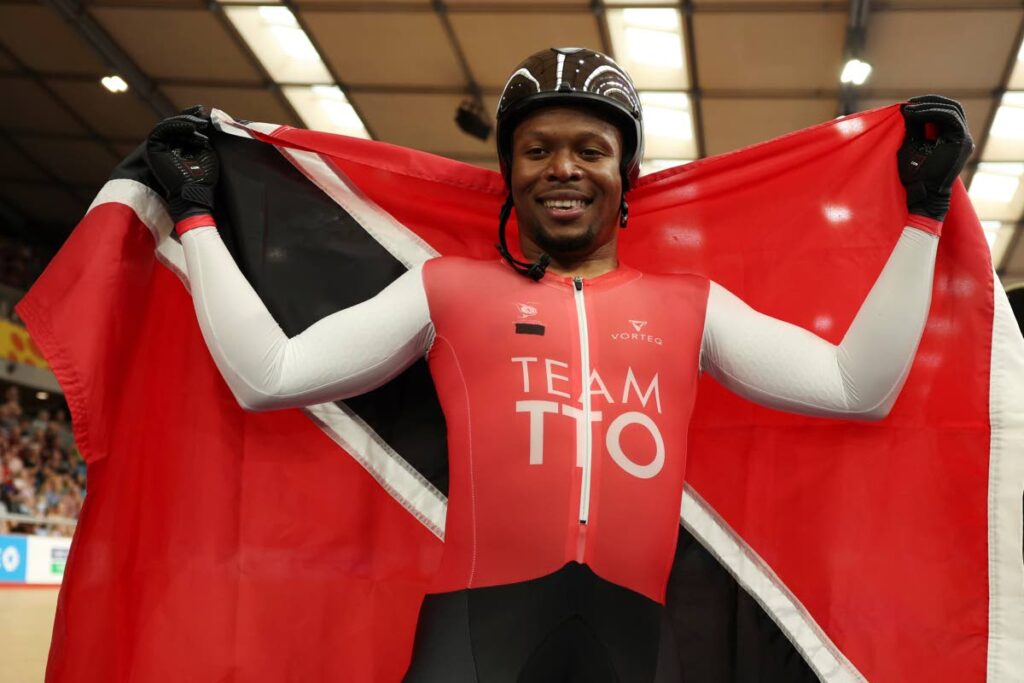 Trinidad And Tobago's Nicholas Paul celebrates after winning the Men's Keirin Gold Final during the Commonwealth Games track cycling at Lee Valley VeloPark in London,on July 30, 2022. - AP PHOTO